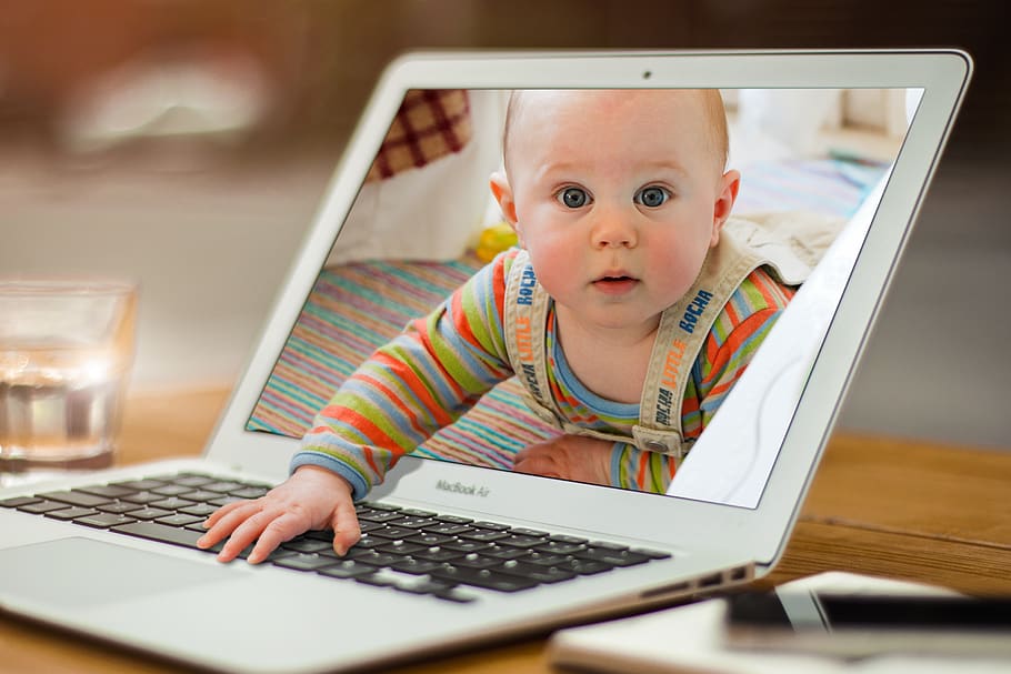 Cute kid in laptop frame